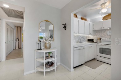 SPECTACULAR CONDO WITH AMAZING WATER VIEW FROM THE 4TH FLOOR on Hillsboro Pines Golf in Florida - for sale on GolfHomes.com, golf home, golf lot