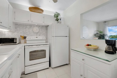 SPECTACULAR CONDO WITH AMAZING WATER VIEW FROM THE 4TH FLOOR on Hillsboro Pines Golf in Florida - for sale on GolfHomes.com, golf home, golf lot
