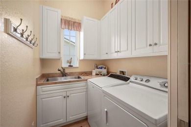 Experience exceptional waterfront living in this custom-built on Twin Isles Country Club in Florida - for sale on GolfHomes.com, golf home, golf lot