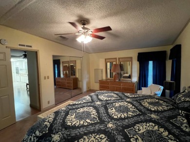 This beautifully maintained 2-bedroom, 2-bathroom Homes of Merit on Lake Henry Golf Club in Florida - for sale on GolfHomes.com, golf home, golf lot