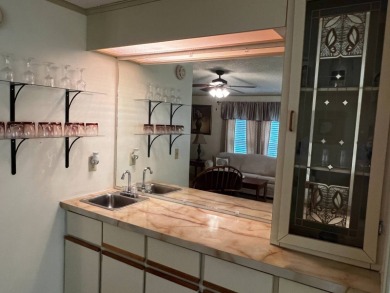 This beautifully maintained 2-bedroom, 2-bathroom Homes of Merit on Lake Henry Golf Club in Florida - for sale on GolfHomes.com, golf home, golf lot