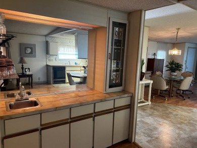 This beautifully maintained 2-bedroom, 2-bathroom Homes of Merit on Lake Henry Golf Club in Florida - for sale on GolfHomes.com, golf home, golf lot
