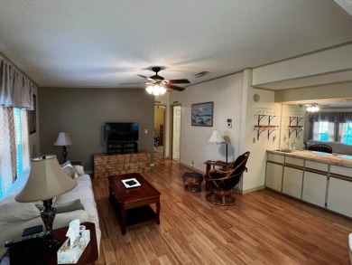 This beautifully maintained 2-bedroom, 2-bathroom Homes of Merit on Lake Henry Golf Club in Florida - for sale on GolfHomes.com, golf home, golf lot