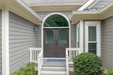 Enjoy effortless, single-level living in this thoughtfully on Great Waters Course At Reynolds Plantation in Georgia - for sale on GolfHomes.com, golf home, golf lot