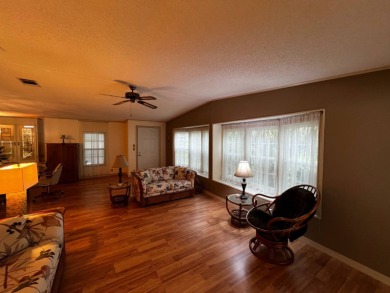 This beautifully maintained 2-bedroom, 2-bathroom Homes of Merit on Lake Henry Golf Club in Florida - for sale on GolfHomes.com, golf home, golf lot