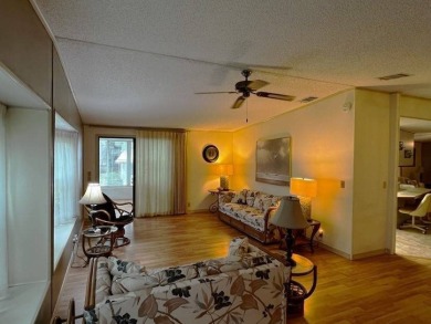 This beautifully maintained 2-bedroom, 2-bathroom Homes of Merit on Lake Henry Golf Club in Florida - for sale on GolfHomes.com, golf home, golf lot