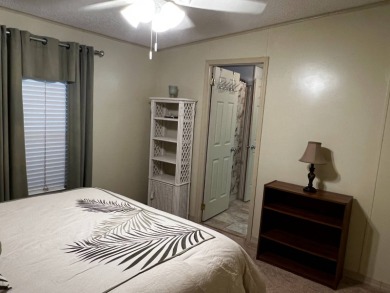 This beautifully maintained 2-bedroom, 2-bathroom Homes of Merit on Lake Henry Golf Club in Florida - for sale on GolfHomes.com, golf home, golf lot