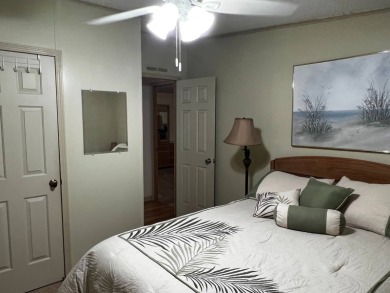 This beautifully maintained 2-bedroom, 2-bathroom Homes of Merit on Lake Henry Golf Club in Florida - for sale on GolfHomes.com, golf home, golf lot