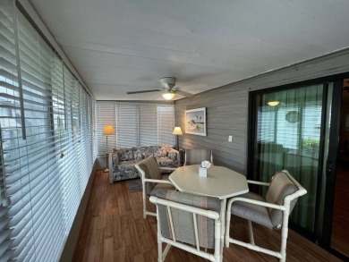 This beautifully maintained 2-bedroom, 2-bathroom Homes of Merit on Lake Henry Golf Club in Florida - for sale on GolfHomes.com, golf home, golf lot