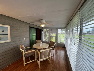 This beautifully maintained 2-bedroom, 2-bathroom Homes of Merit on Lake Henry Golf Club in Florida - for sale on GolfHomes.com, golf home, golf lot