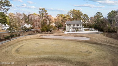 Stunning 4-bedroom, 3.5-bathroom home nestled on Hole 15 of the on Brandywine Bay Golf Club in North Carolina - for sale on GolfHomes.com, golf home, golf lot