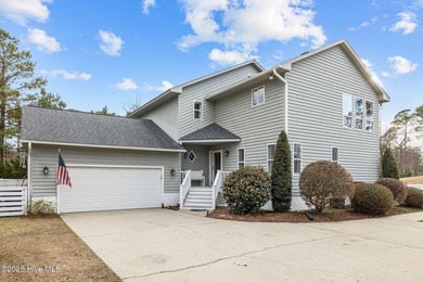 Stunning 4-bedroom, 3.5-bathroom home nestled on Hole 15 of the on Brandywine Bay Golf Club in North Carolina - for sale on GolfHomes.com, golf home, golf lot