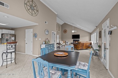 Stunning 4-bedroom, 3.5-bathroom home nestled on Hole 15 of the on Brandywine Bay Golf Club in North Carolina - for sale on GolfHomes.com, golf home, golf lot