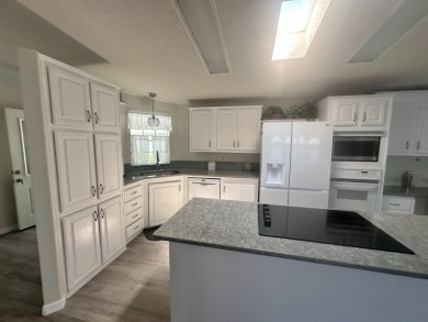 BEAUTIFUL 3 BEDROOM HOME ON GOLF COURSE WITH A GARAGE - REDUCED on Four Lakes Golf Club in Florida - for sale on GolfHomes.com, golf home, golf lot