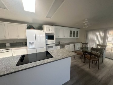 BEAUTIFUL 3 BEDROOM HOME ON GOLF COURSE WITH A GARAGE - REDUCED on Four Lakes Golf Club in Florida - for sale on GolfHomes.com, golf home, golf lot