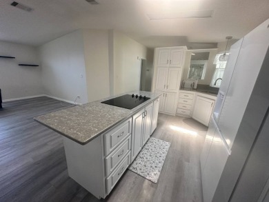 BEAUTIFUL 3 BEDROOM HOME ON GOLF COURSE WITH A GARAGE - REDUCED on Four Lakes Golf Club in Florida - for sale on GolfHomes.com, golf home, golf lot