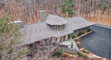 This exceptional mountain estate is a true architectural on Big Canoe Golf Club - Cherokee in Georgia - for sale on GolfHomes.com, golf home, golf lot