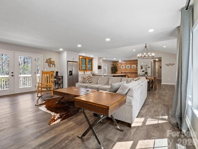 This recently renovated home with an open concept living space on Rumbling Bald Resort on Lake Lure in North Carolina - for sale on GolfHomes.com, golf home, golf lot