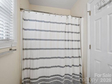 This recently renovated home with an open concept living space on Rumbling Bald Resort on Lake Lure in North Carolina - for sale on GolfHomes.com, golf home, golf lot