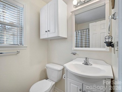 This recently renovated home with an open concept living space on Rumbling Bald Resort on Lake Lure in North Carolina - for sale on GolfHomes.com, golf home, golf lot