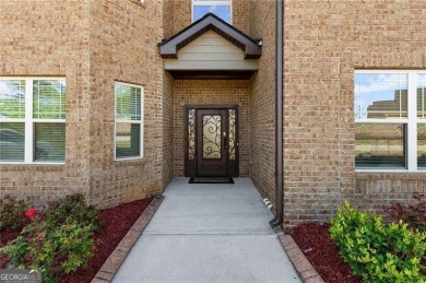 Welcome to 404 Prague Way, an exquisite residence nestled in the on Crystal Lake Golf and Country Club in Georgia - for sale on GolfHomes.com, golf home, golf lot