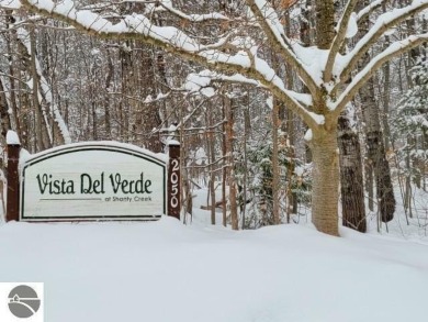 Vista Del Verde #4 is a peaceful corner condo that overlooks the on Schuss Mountain Golf Club in Michigan - for sale on GolfHomes.com, golf home, golf lot