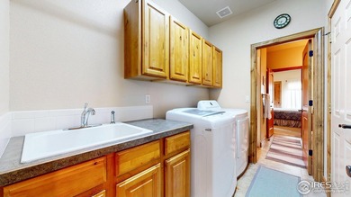 Nestled in the coveted Highland Meadows Golf Course community on Highland Meadows Golf Course in Colorado - for sale on GolfHomes.com, golf home, golf lot