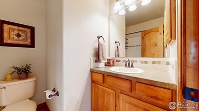 Nestled in the coveted Highland Meadows Golf Course community on Highland Meadows Golf Course in Colorado - for sale on GolfHomes.com, golf home, golf lot