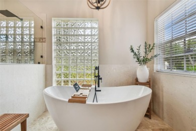 Under contract-accepting backup offers. Exquisite and with on East Lake Woodlands Country Club in Florida - for sale on GolfHomes.com, golf home, golf lot