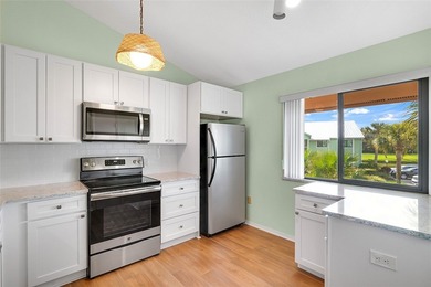 Charming 2BR/2BA condo w/ beautiful lake & golf views, soaring on Pelican Pointe 9 Hole Course in Florida - for sale on GolfHomes.com, golf home, golf lot