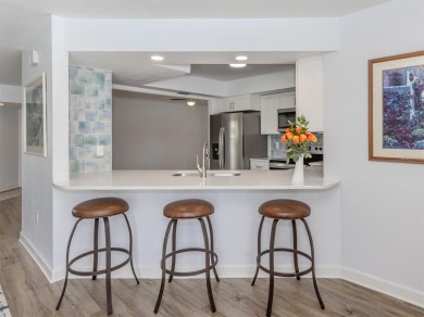 A newly renovated residence with a stunning water view is poised on Sarasota National Golf Club in Florida - for sale on GolfHomes.com, golf home, golf lot