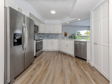 A newly renovated residence with a stunning water view is poised on Sarasota National Golf Club in Florida - for sale on GolfHomes.com, golf home, golf lot
