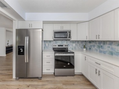 A newly renovated residence with a stunning water view is poised on Sarasota National Golf Club in Florida - for sale on GolfHomes.com, golf home, golf lot