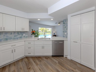 A newly renovated residence with a stunning water view is poised on Sarasota National Golf Club in Florida - for sale on GolfHomes.com, golf home, golf lot