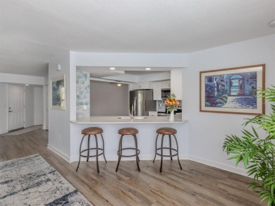 A newly renovated residence with a stunning water view is poised on Sarasota National Golf Club in Florida - for sale on GolfHomes.com, golf home, golf lot