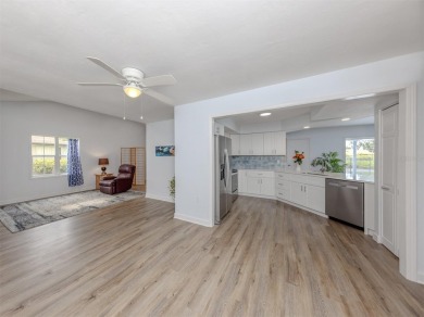 A newly renovated residence with a stunning water view is poised on Sarasota National Golf Club in Florida - for sale on GolfHomes.com, golf home, golf lot