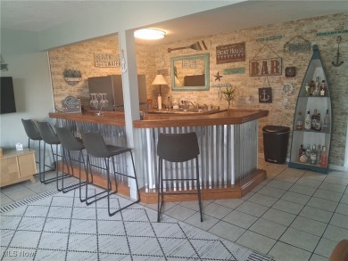 Amazing panoramic lake views from front and back of home. This on Lake Mohawk Golf Club in Ohio - for sale on GolfHomes.com, golf home, golf lot