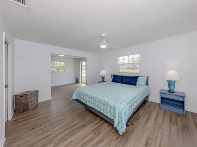 A newly renovated residence with a stunning water view is poised on Sarasota National Golf Club in Florida - for sale on GolfHomes.com, golf home, golf lot