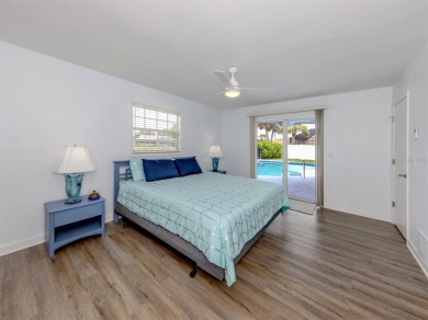 A newly renovated residence with a stunning water view is poised on Sarasota National Golf Club in Florida - for sale on GolfHomes.com, golf home, golf lot