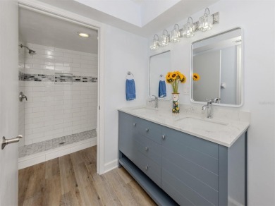 A newly renovated residence with a stunning water view is poised on Sarasota National Golf Club in Florida - for sale on GolfHomes.com, golf home, golf lot