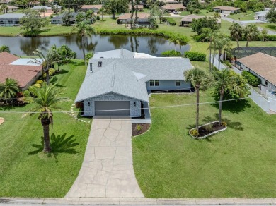 A newly renovated residence with a stunning water view is poised on Sarasota National Golf Club in Florida - for sale on GolfHomes.com, golf home, golf lot