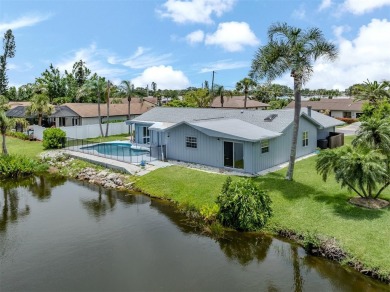 A newly renovated residence with a stunning water view is poised on Sarasota National Golf Club in Florida - for sale on GolfHomes.com, golf home, golf lot