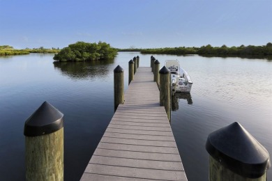 A newly renovated residence with a stunning water view is poised on Sarasota National Golf Club in Florida - for sale on GolfHomes.com, golf home, golf lot