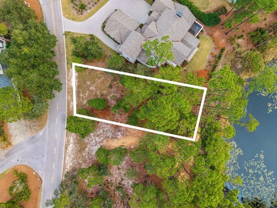 Tucked within the private gates of Wild Heron, 1203 W Water Oak on Sharks Tooth Golf Club in Florida - for sale on GolfHomes.com, golf home, golf lot