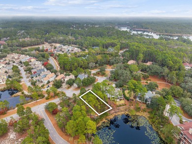 Tucked within the private gates of Wild Heron, 1203 W Water Oak on Sharks Tooth Golf Club in Florida - for sale on GolfHomes.com, golf home, golf lot