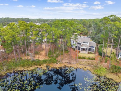 Tucked within the private gates of Wild Heron, 1203 W Water Oak on Sharks Tooth Golf Club in Florida - for sale on GolfHomes.com, golf home, golf lot
