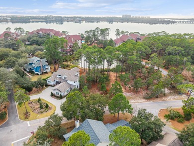 Tucked within the private gates of Wild Heron, 1203 W Water Oak on Sharks Tooth Golf Club in Florida - for sale on GolfHomes.com, golf home, golf lot