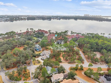 Tucked within the private gates of Wild Heron, 1203 W Water Oak on Sharks Tooth Golf Club in Florida - for sale on GolfHomes.com, golf home, golf lot