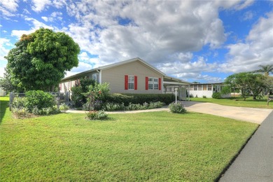 Fruit Trees, Sunshine & Freedom-it's all here on a fenced lot on Barefoot Bay Golf Course in Florida - for sale on GolfHomes.com, golf home, golf lot