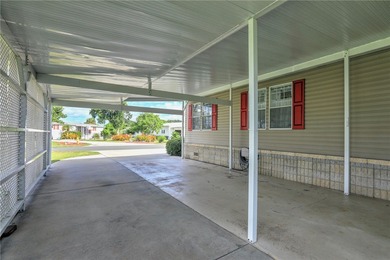 Fruit Trees, Sunshine & Freedom-it's all here on a fenced lot on Barefoot Bay Golf Course in Florida - for sale on GolfHomes.com, golf home, golf lot